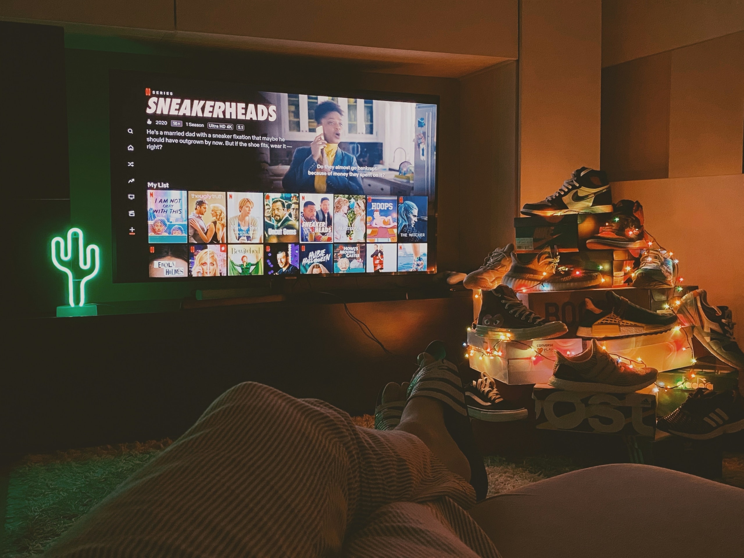 black flat screen tv turned on displaying man in black suit